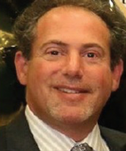 DR. ADAM M. STUART '86