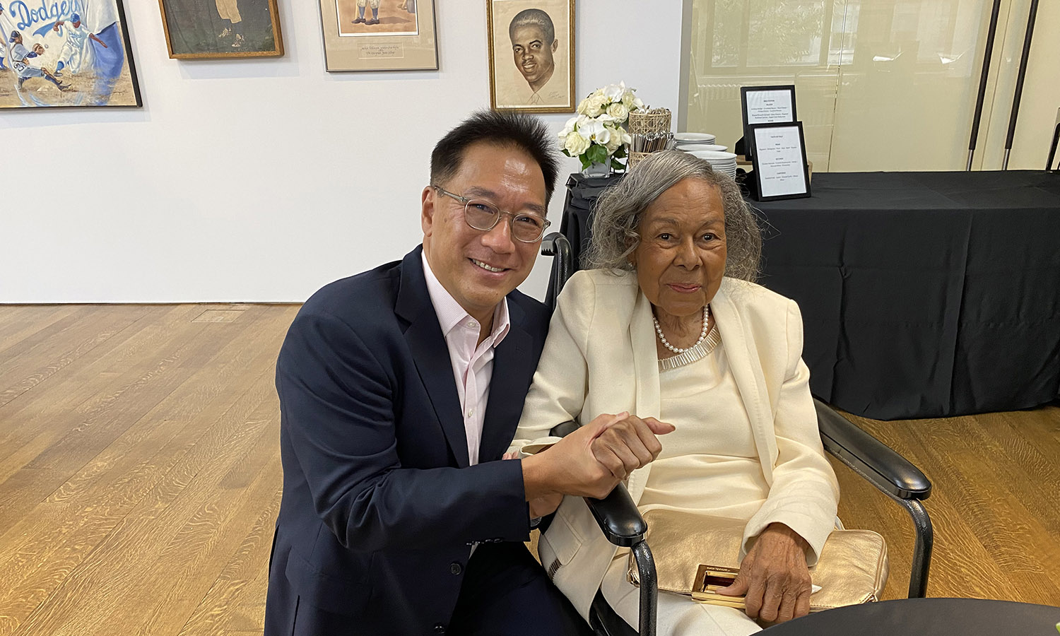 Stephen Wong '89 and Rachel Robinson, wife of baseball legend, Jackie Robinson, posing for a photo.