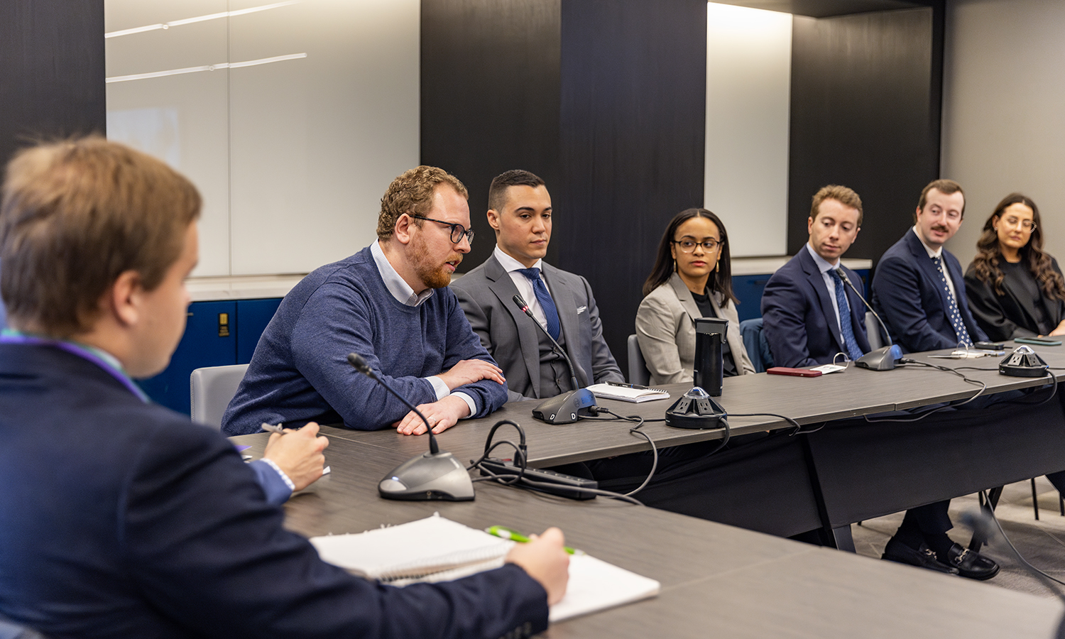 People sit at conference table