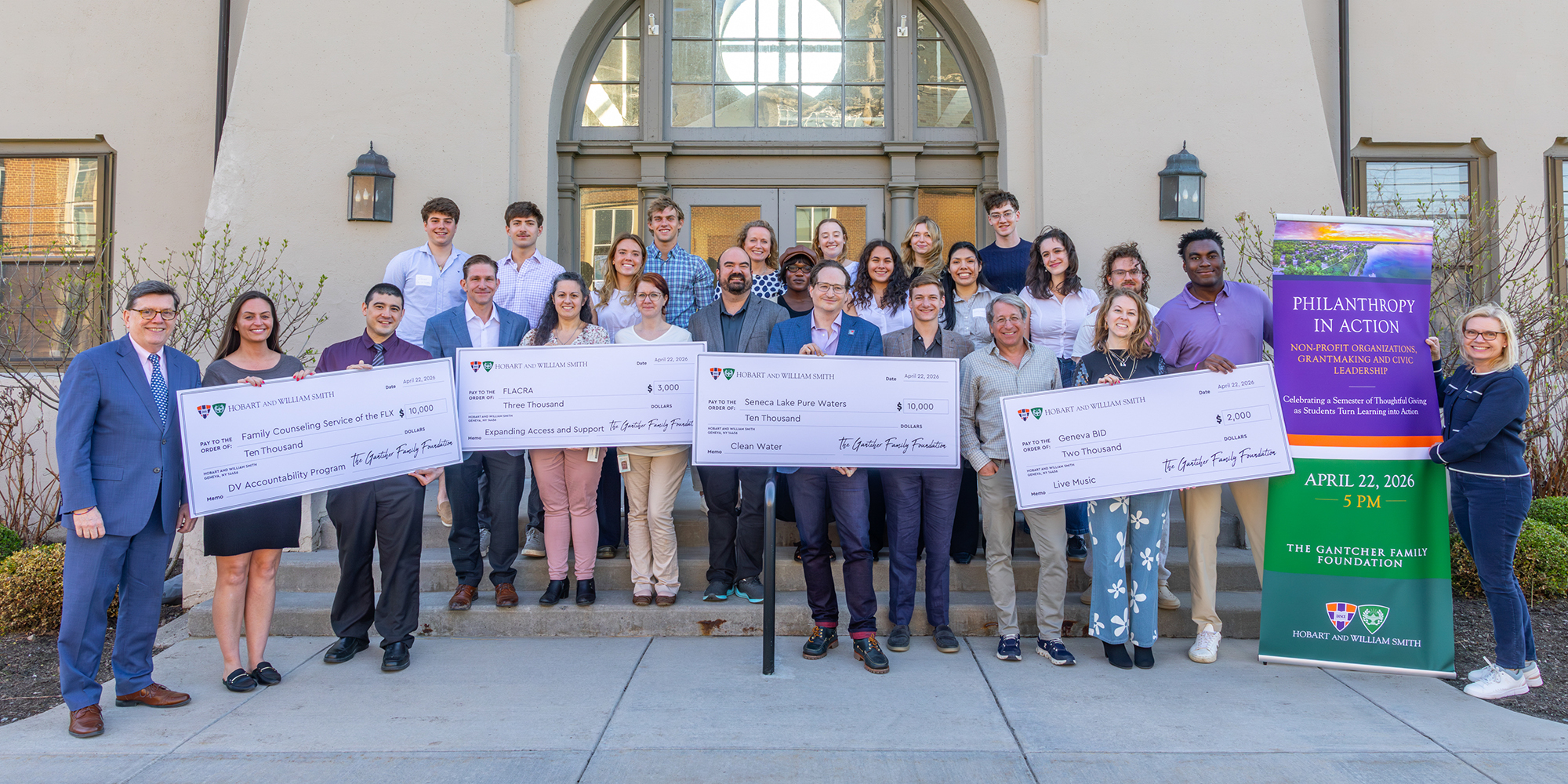 Group photo people holding big checks