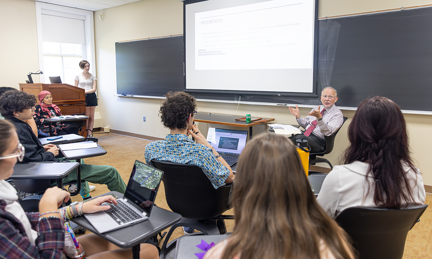 cohen talks at front of classroom in stern hall