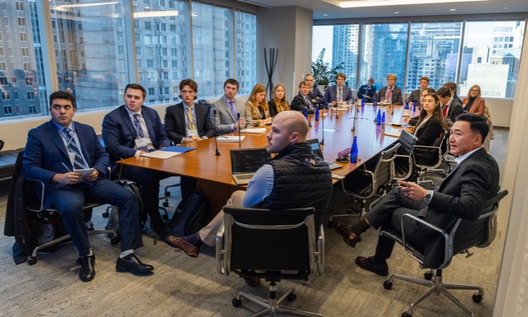 Students in a board room