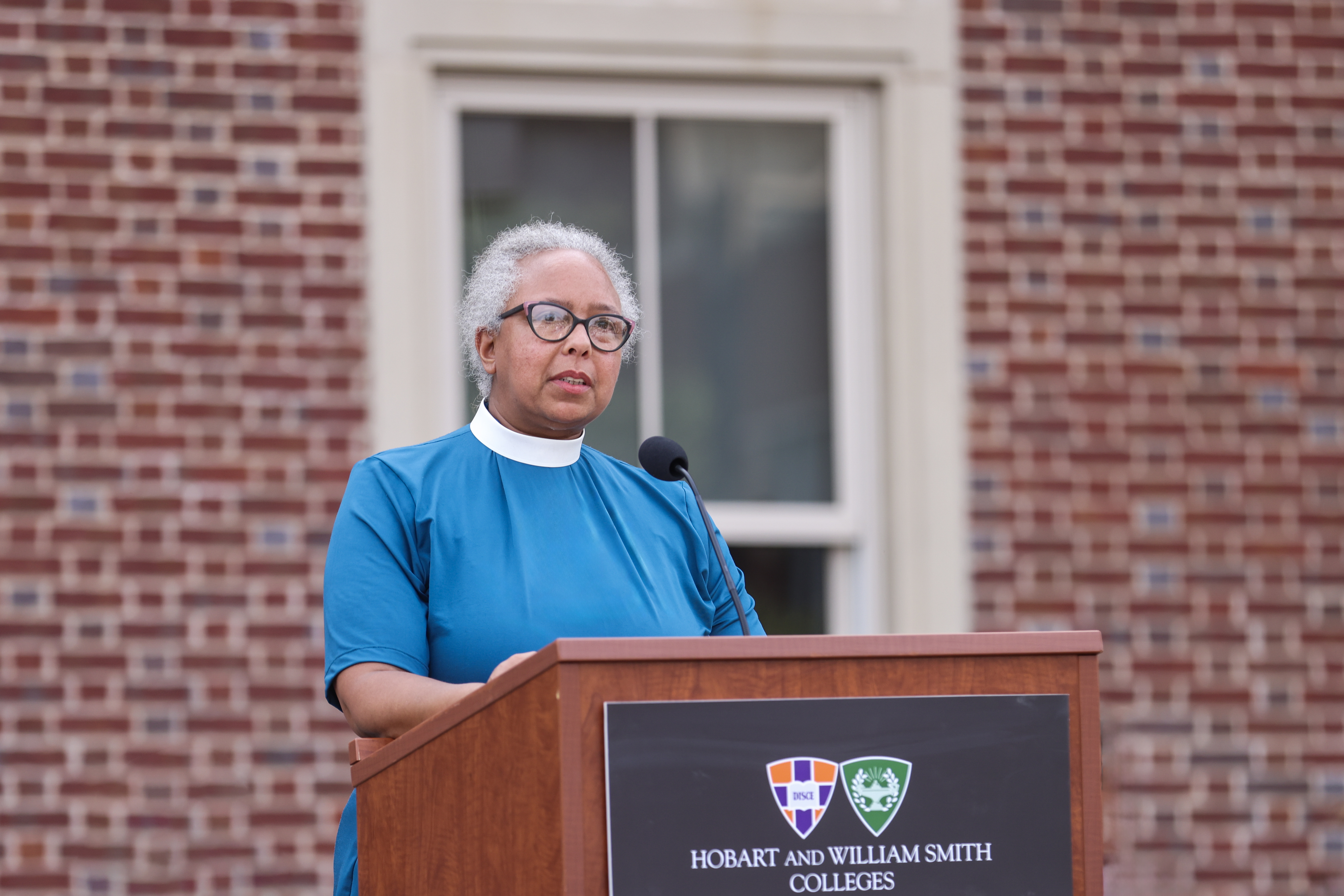 Nita Byrd speaks at a podium