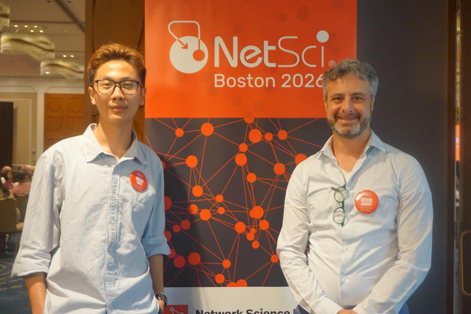 Randy Hong '26 and Professor Daniel Graham pose at the NetSci 2026 Conference after presenting. 