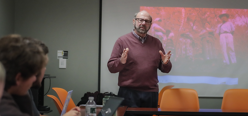 Professor Dobkowski teaching in a classroom