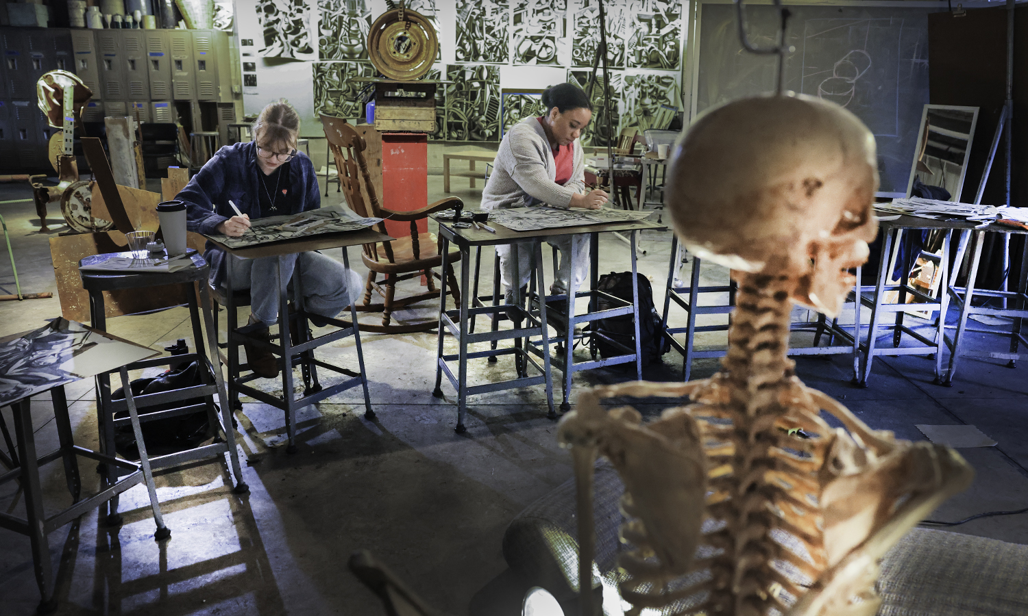 Reagan Wolf ’23 and Alexis McNair ’23 work on drawings for their class with Professor of Art and Architecture Ted Aub in the Katherine D. Elliott Studio Arts Center.