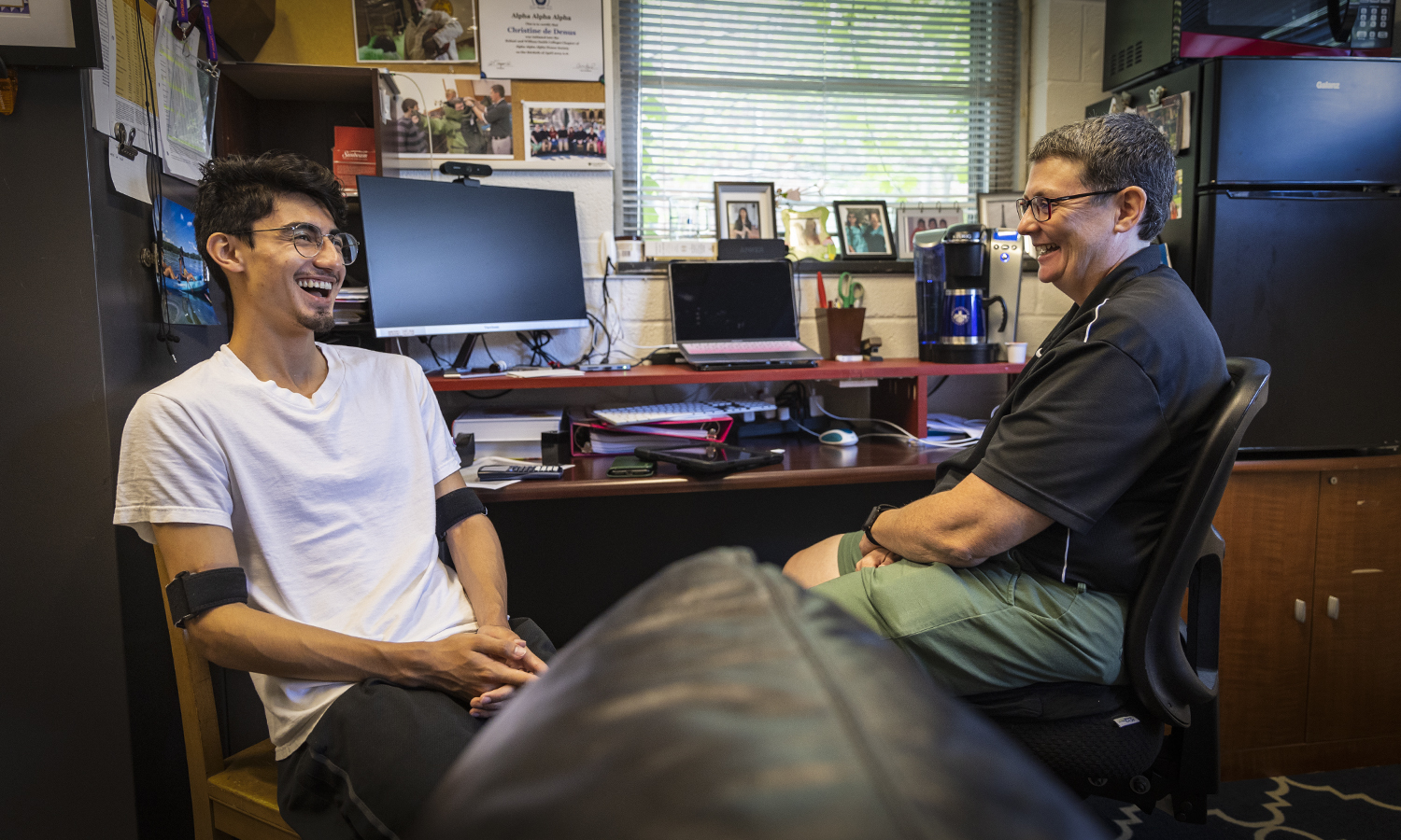 Will Argueta ’24 enjoys catching up with Associate Professor of Chemistry Christine de Denus.