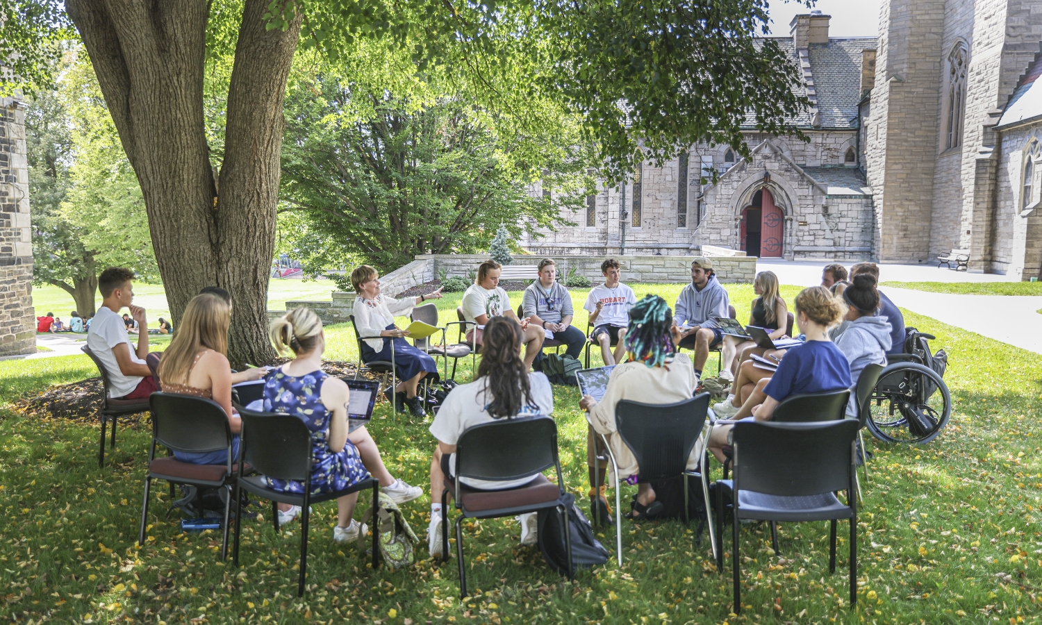 Assistant Professor of Philosophy Carol Oberbrunner discusses Plato’s essay “The Ion” with students in her “Aesthetics” class outside on Wednesday.