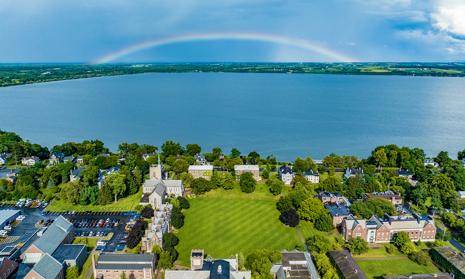 Between rainstorms on Monday, a rainbow appears on the east side of Seneca Lake.