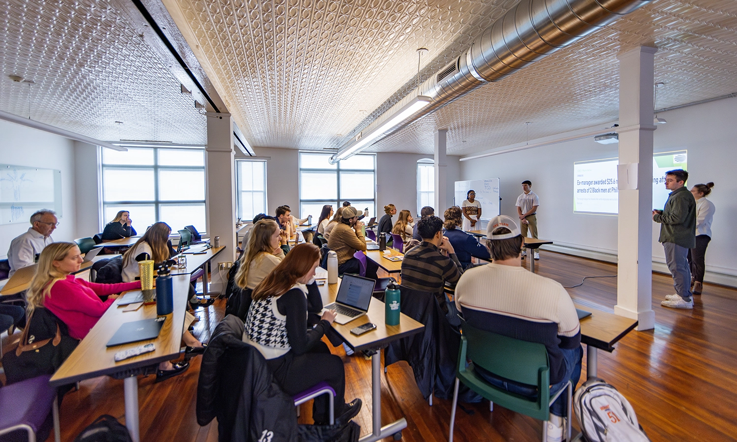 Master’s students offer their final presentations during “Management Strategies” with Professor of Management and Entrepreneurship Tom Drennen and Visiting Assistant Professor of Environmental Studies Robinson Murphy.