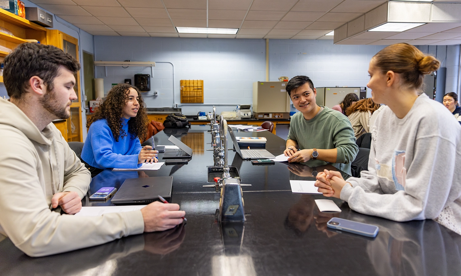 Jack Hodge ’24, Malak Fadlou-Allah ’24, Cameron Guan ’24 and Fiona Horan ’24 work on a group project during “Genomics” with Associate Professor of Biology Shannon Straub.