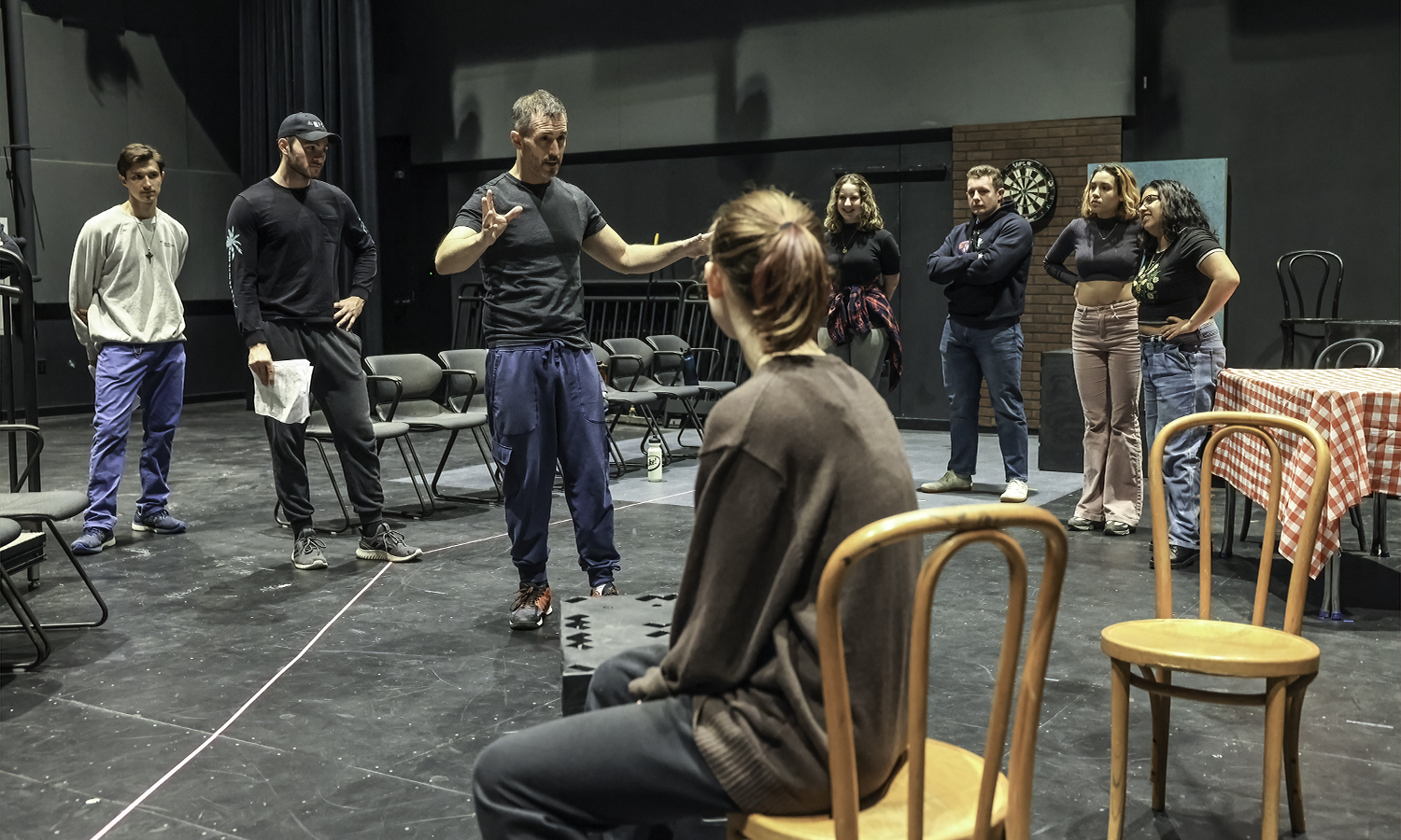 Associate Professor of Theatre Chris Hatch leads students during rehearsal for “Much Ado About Nothing” in the McDonald Theatre on Monday night.