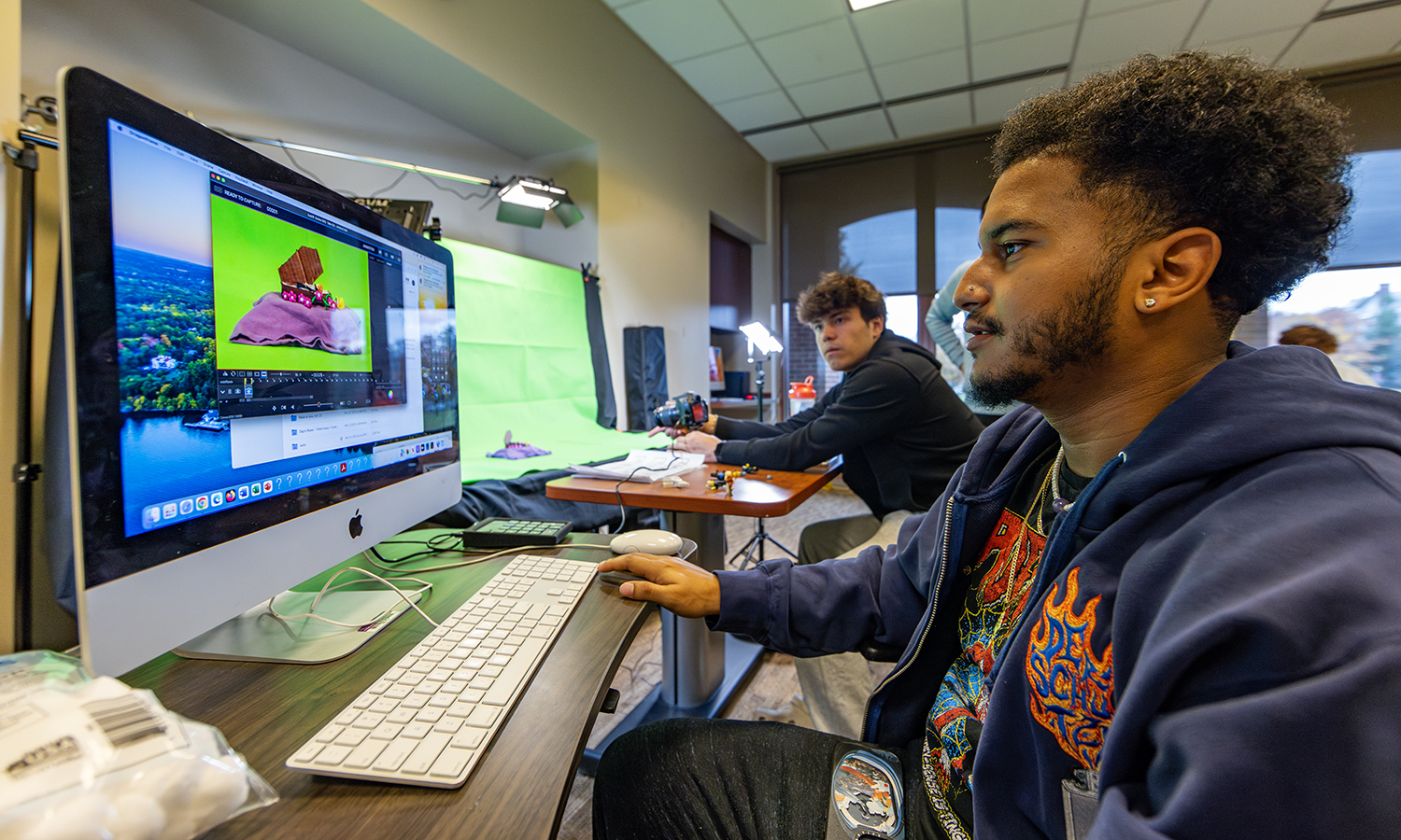 Gavin Meador ‘27 and Joshua Cruz ’24 work on a stop motion project in “Intro to Global Animation” with Assistant Professor of Media and Society Iskandar Zulkarnain.