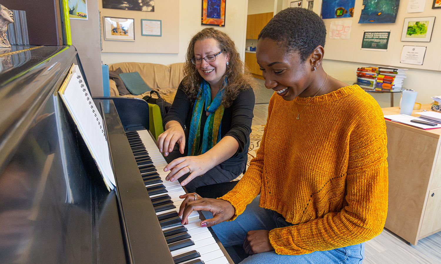 After collaborating on a music theory research project, Eliyah Roberts ’24 plays piano with her adviser, Associate Professor of Music Charity Lofthouse. They will present their work at the Theorizing African American Music conference in Denver in November.