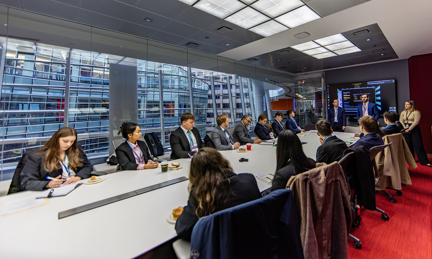 At Bloomberg in Midtown Manhattan, students and Professor of Economics Feisal Khan hear from Matthew Fox ’19, Joseph Gibbons ’14 and Kelsie Worth ’22 about their careers at the financial software company.