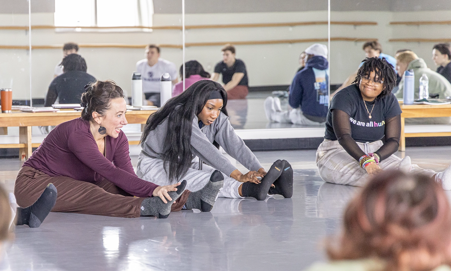 Associate Professor of Dance and Movement Studies Kelly Johnson leads students in a stretch during “Introduction to Dances of the African Diaspora.”