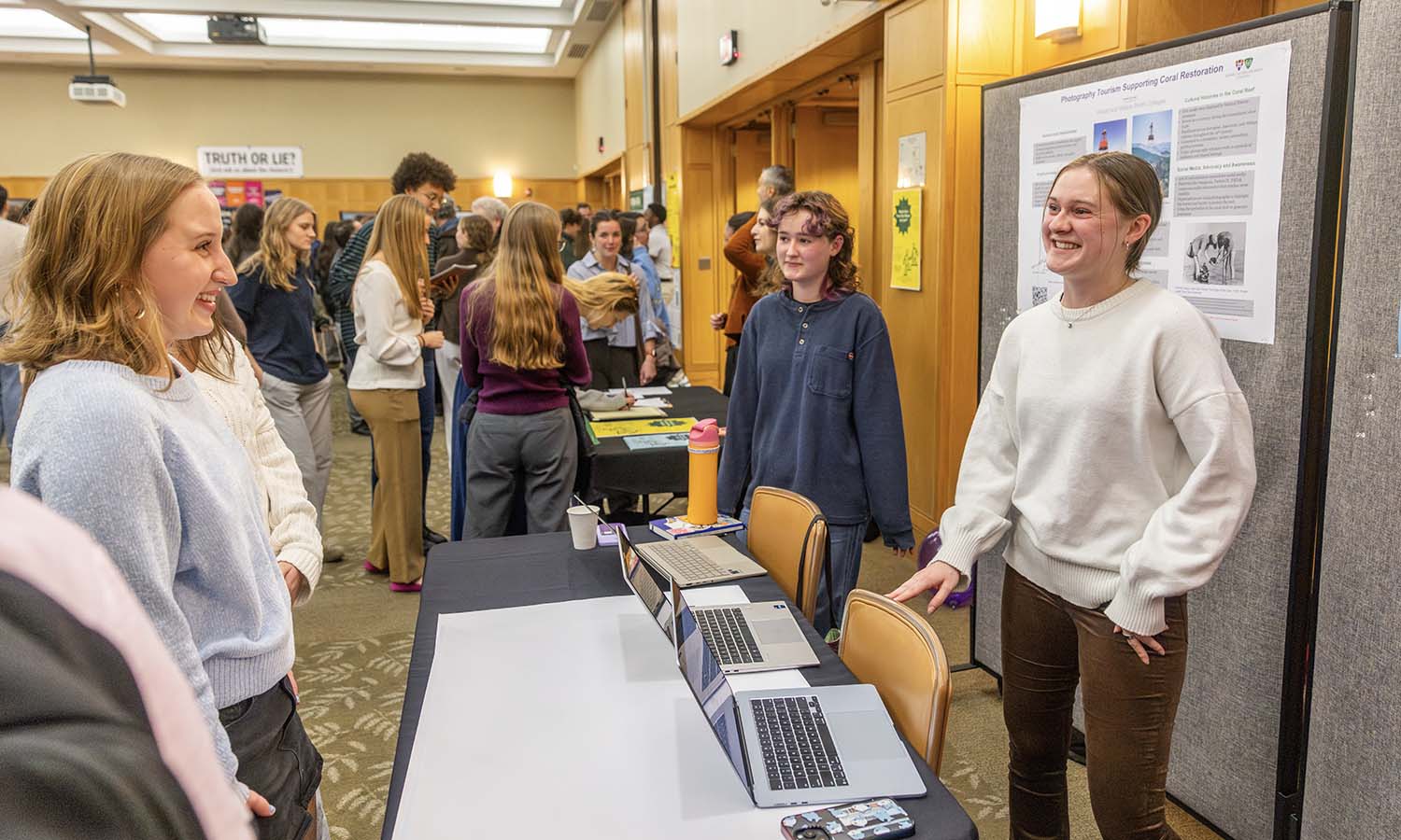 Kaileigh Brady ’29 explains the use of coral in medicine that she researched in “CORALations” with Professor of History Lisa Yoshikawa. 