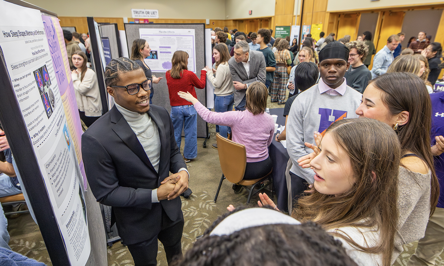 Latrell Martin ’29 presents his research findings on “How Sleep Shapes Memory and Performance.” The work was conducted under the direction of Professor of Chemistry Kristin Slade. 