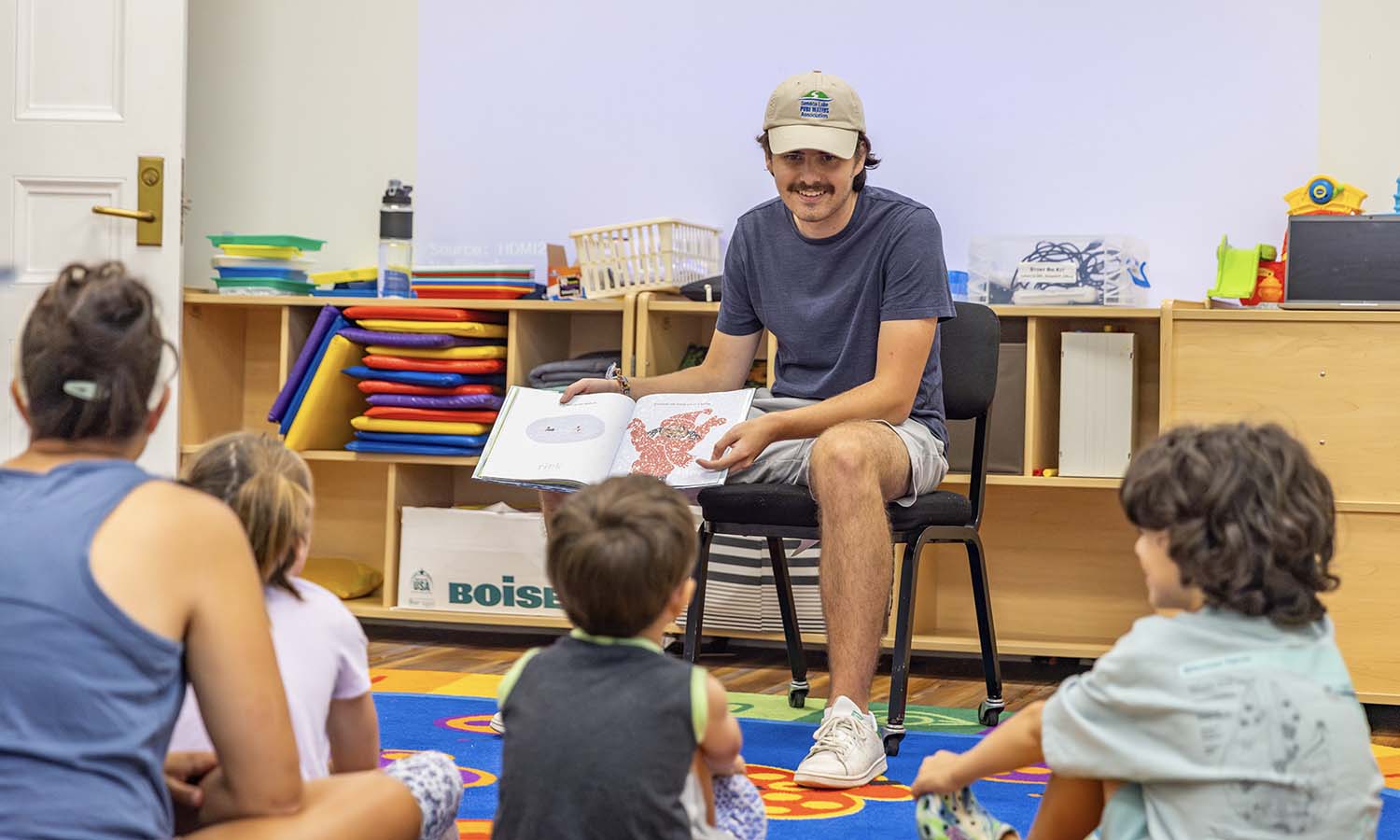 While interning with Seneca Lake Pure Waters Association, Jackson Abreu ‘25 reads to children at the Geneva Public Library to teach them about the importance of water. 