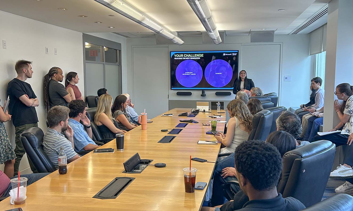 Isa Daniels ’27 presents a sales pitch to her colleagues at Screenvision Media, where she completed an internship. 