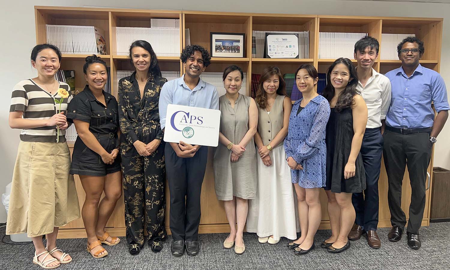 Sandeep Tissaaratchy ’26 gathers with his colleagues at the Centre for Asian Philanthropy and Society in Hong Kong, where he is interning this summer. 