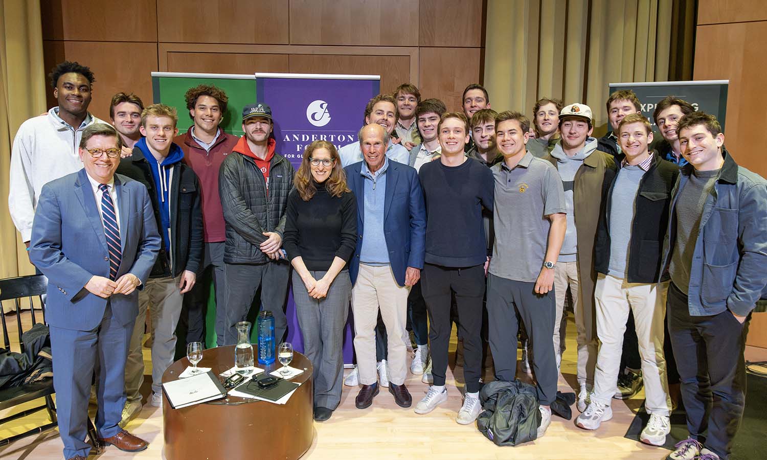 President Gearan, former Trustee James F. Anderton IV ’65 (center) and author Wendy Pearlman gather with members of Sigma Phi (Anderton’s fraternity) after the Anderton Forum for Global Engagement. Anderton is a real estate investment executive. 