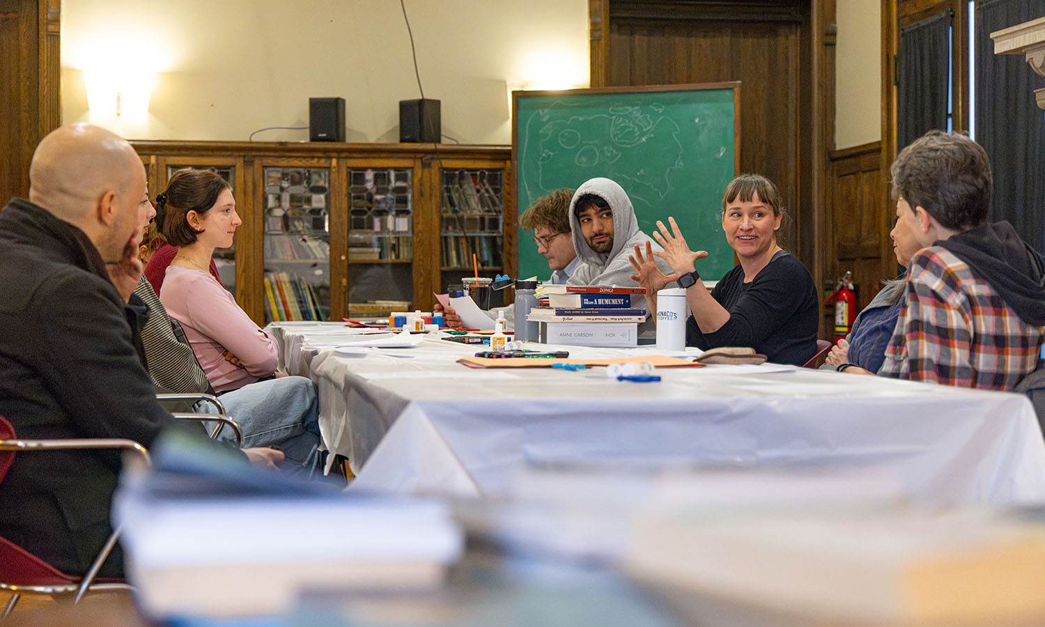 Associate Professor of English and Creative Writing Kathryn Cowles leads a found-text art workshop at Houghton House. 