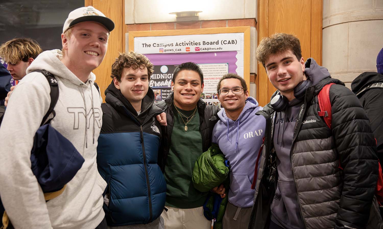 Jameson Ardis '26, Sebastian Iancu '29, Joseph Thompson '29, Christopher Woody '27, and Gerard Humiston '28 pose for a photo while waiting in line for the semi-annual midnight breakfast.   