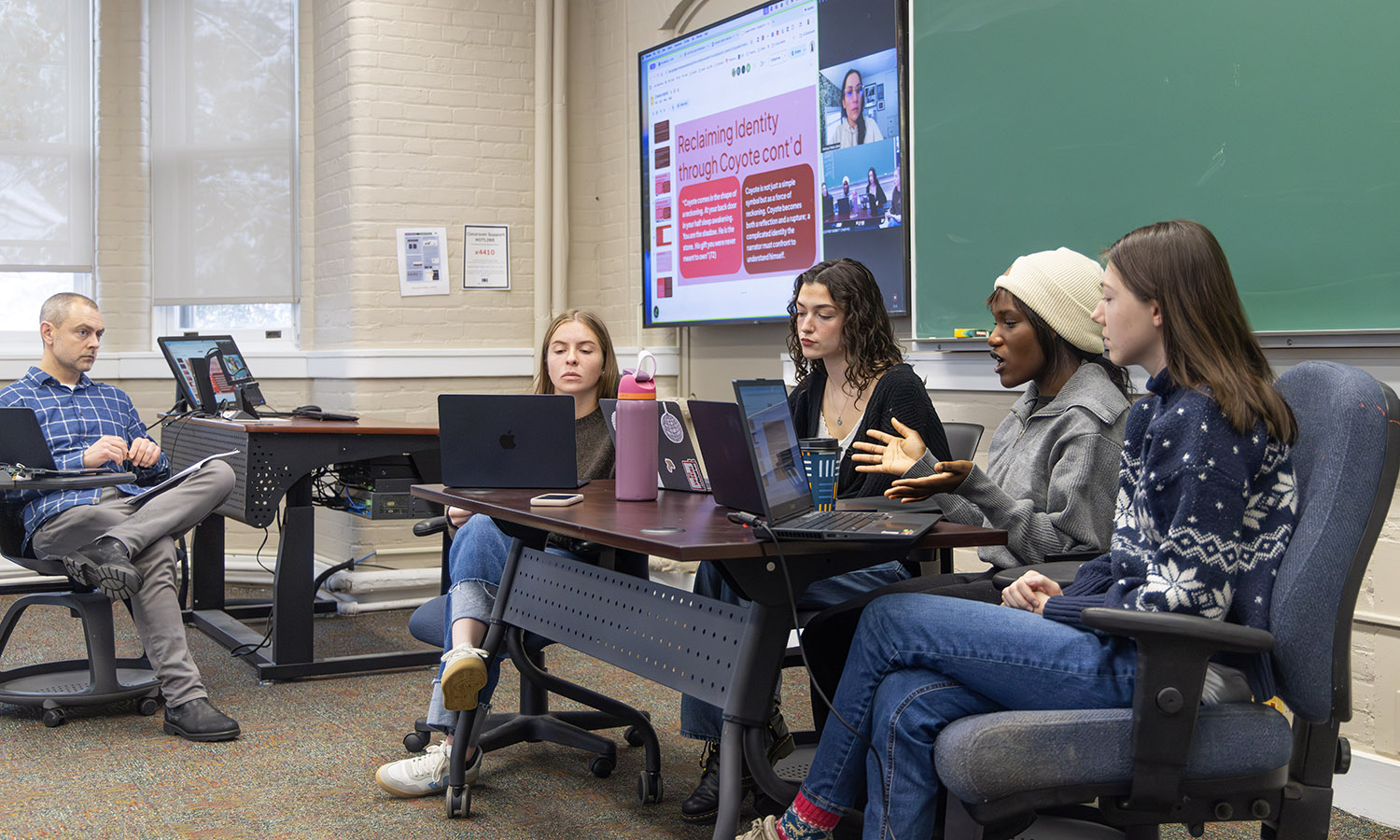 Students in Associate Professor of Writing and Rhetoric Geoff Babbitt's "Small Press Book Publishing" course propose a manuscript for publication to author Melissa Febos.  