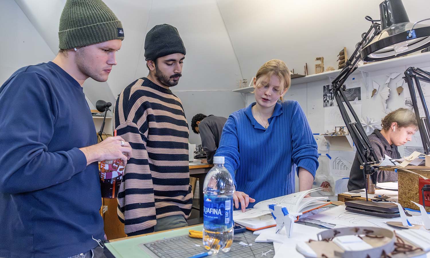 During “Architecture Design Studio” with Assistant Professor of Art and Architecture Max Piersol ’16, Tim Trakhachov ’26 and Ali Muzaffar ’26 provide feedback to Caroline Schroth ‘27 on her final project drawings. 