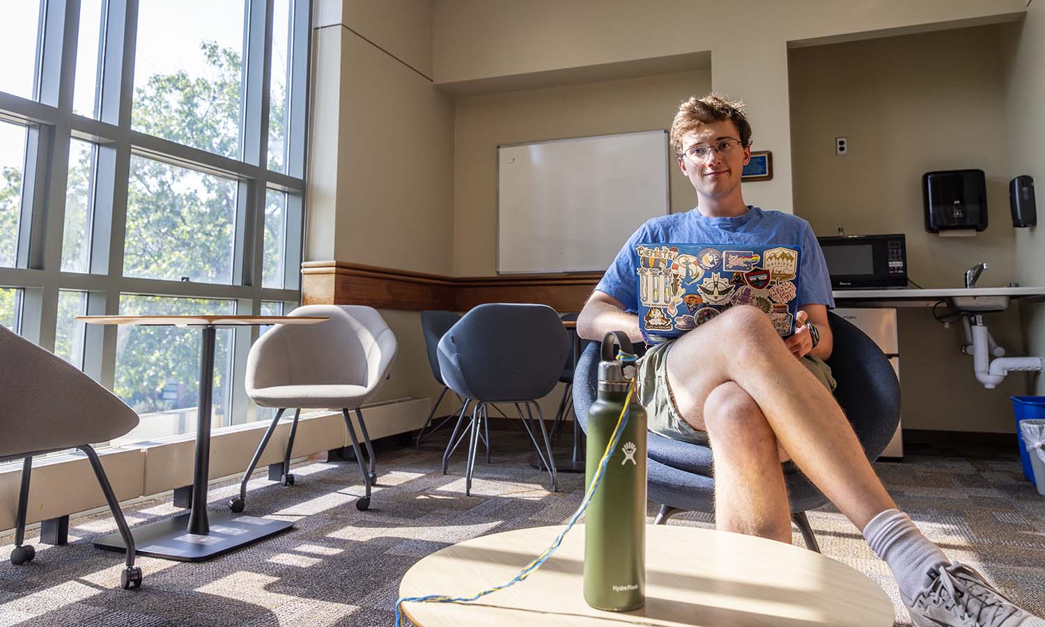 Daniel Adelman ’25 finds the “fishbowl” of Rosenberg Hall a great place to study comfortably with lots of space to spread out. 