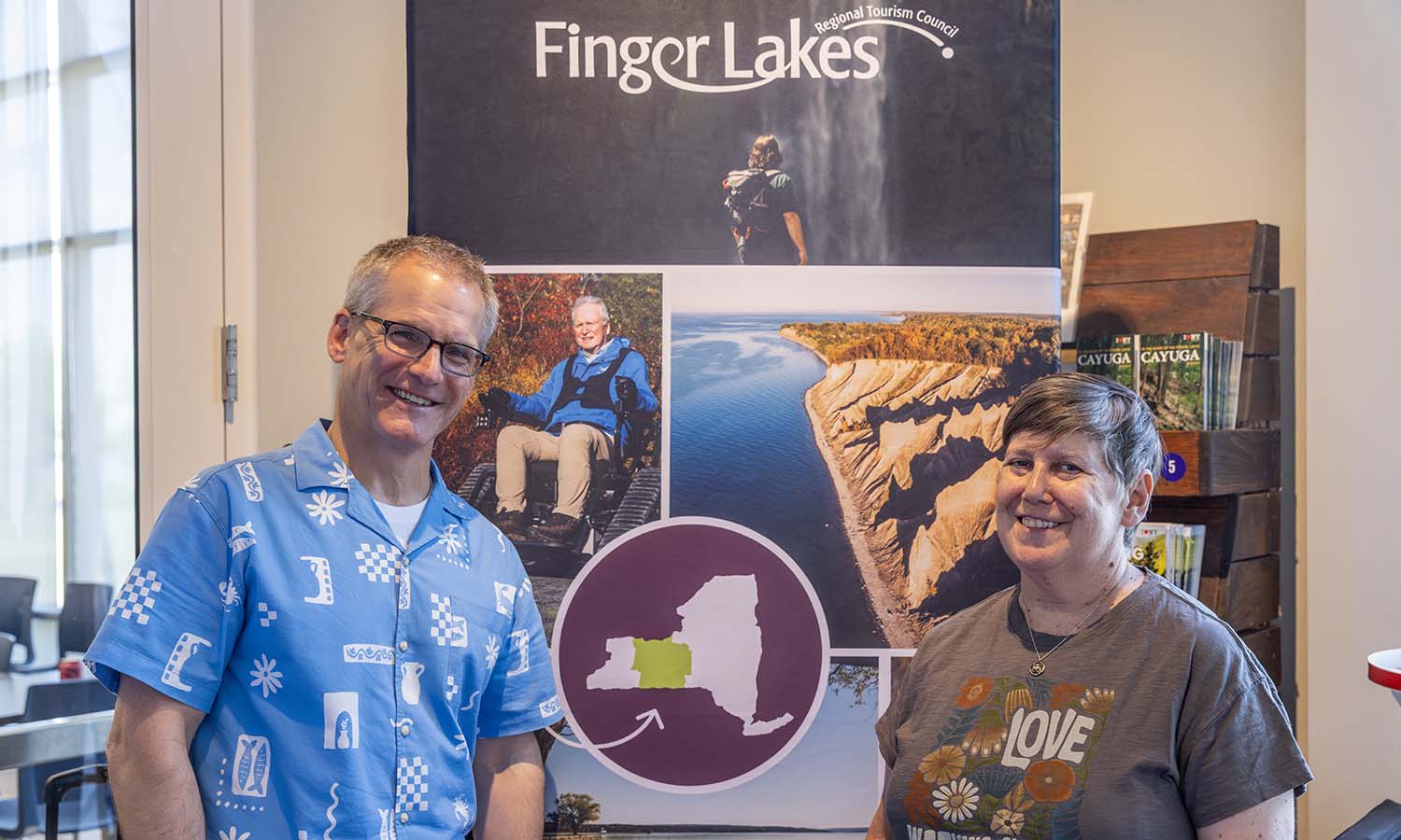 Rob Holmes ‘92, founder and chief strategist at GLP Films, and Erika Piik ‘87, brand strategist at GLP Films, pose for a photo during the FLX Outdoor Experience Launch at the Finger Lakes Welcome Center. GLP Films produced a series of six films highlighting outdoor experiences in the Finger Lakes region. 