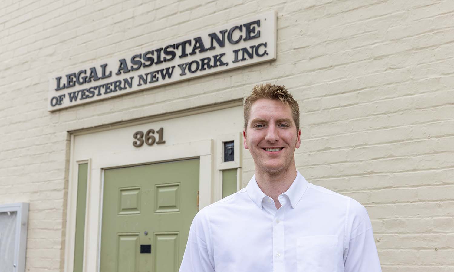 Niko Lutz ‘26 poses for a photo outside Legal Assistance of Western New York, Inc. where he is a Legal Services Intern this summer. 
