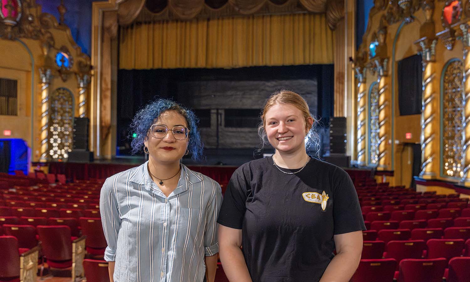 Azure Sage ‘27 and Anna Pedone ‘27 pose for a photo inside the Smith Opera House, where they are interning this summer. 