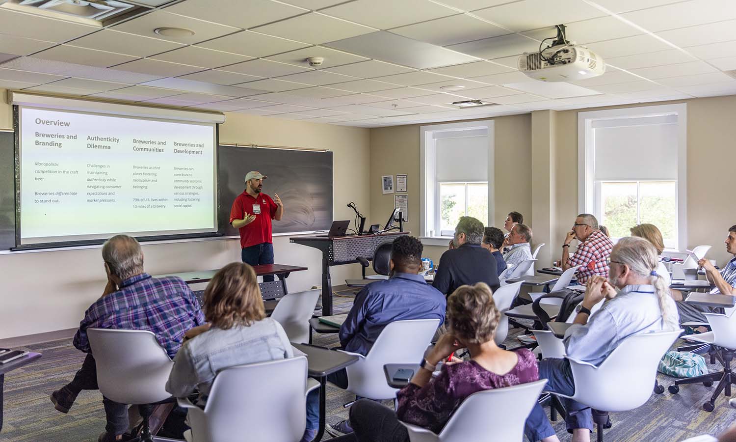 Associate Professor of Business Management and Entrepreneurship Craig Talmage gives a talk on how craft breweries leverage neolocalism to foster community identity, economic resilience and social connection during the Community Development Society conference hosted on campus. 