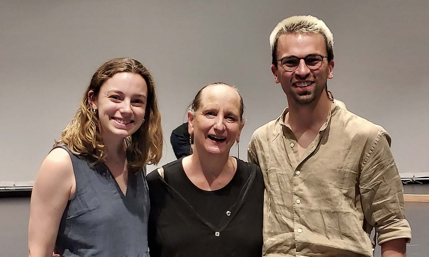 Alexandra Bilodeau ‘20 and Drew Scammell ‘18 pose for a photo with Professor of Dance and Movement Studies Cynthia Williams after returning to campus to participate in the Somatic Dance Conference & Performance Festival. 