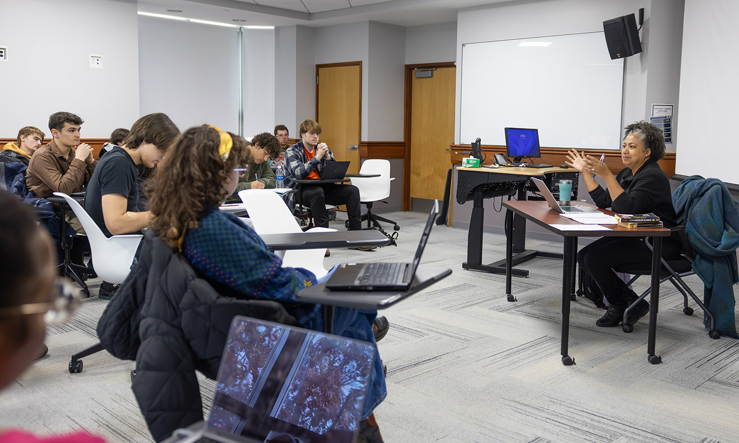 Associate Professor of English and Creative Writing Nicola Minott-Ahl and students discuss "The Hunger Games" in "From Novel to Film."  