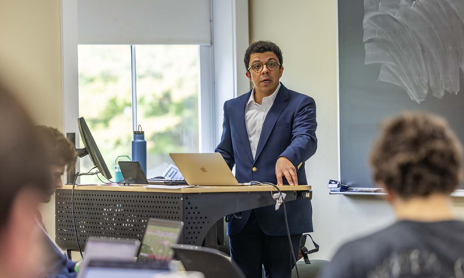 Visiting Assistant Professor of History Yuri Gama lectures on miasma theory with students in “Latin American History.” 