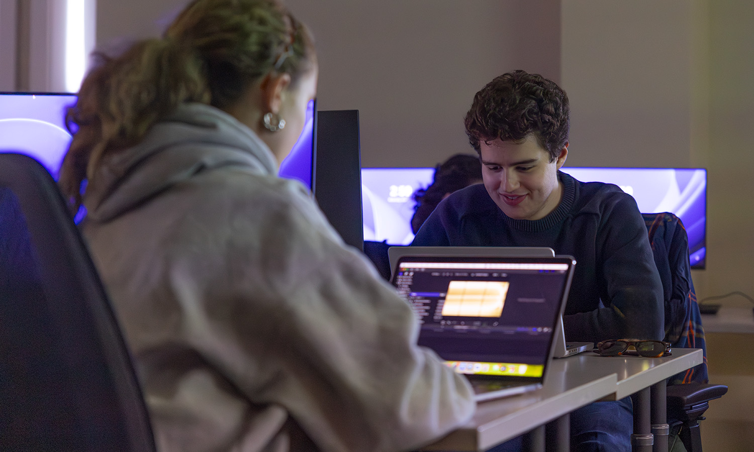 Grant Lover '27 edits an audio project in Stern Hall during "Film Editing," with Instructor of Practice for Media and Society Casey Puccini. 