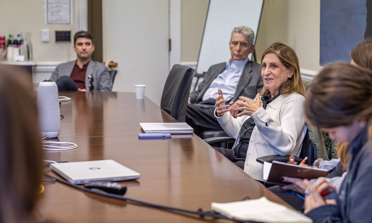 Ruth Marcus, contributing writer for The New Yorker, and former opinion columnist and deputy editorial page editor at The Washington Post, meets with students and faculty before the Stern Family Forum. With her is Honorary Trustee Herbert J. Stern ’58, P’03, LL.D. ’74, and his son, Trustee Samuel A. Stern ’03.  