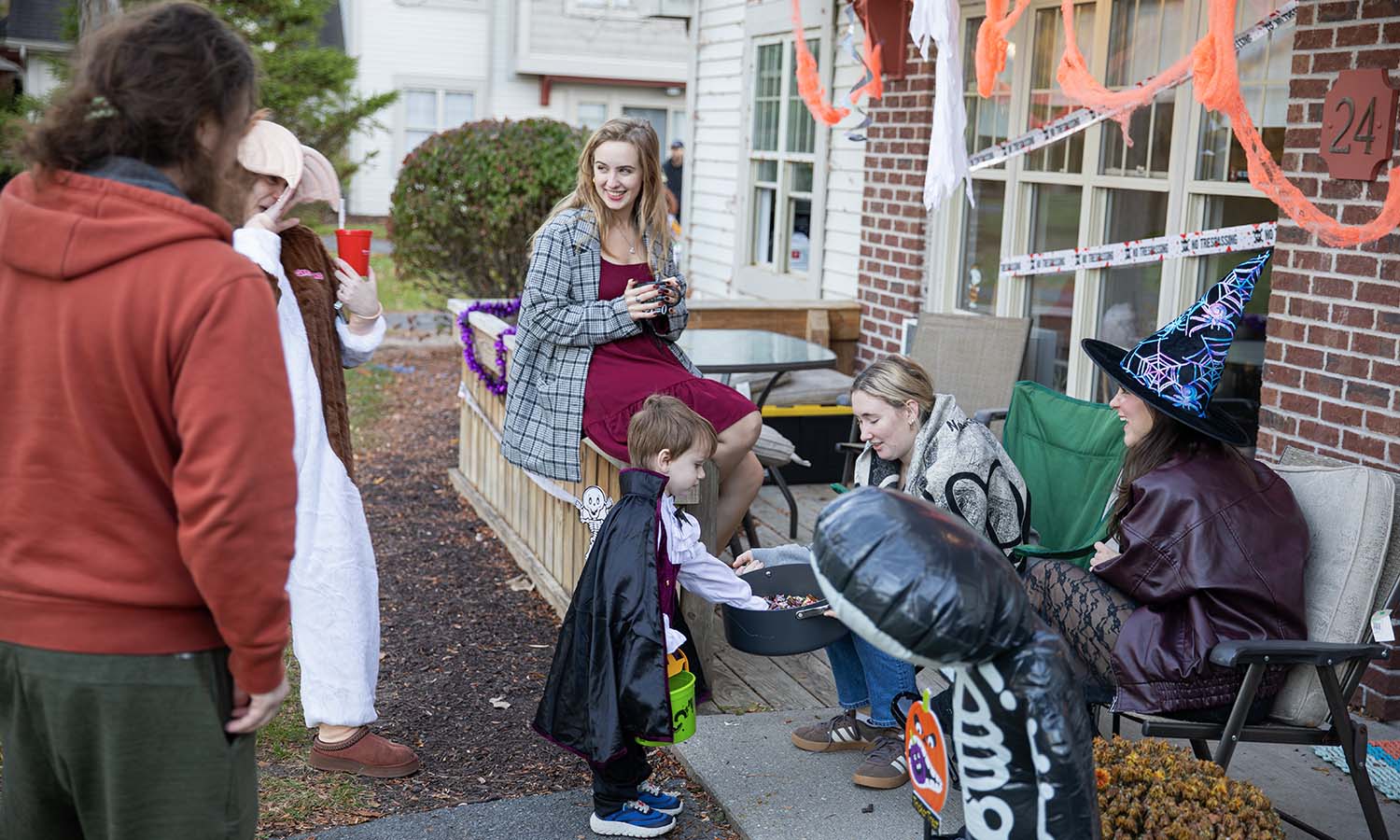 Members of the HWS community and their families go trick-or-treating at the Village at Odells Pond on Halloween. 