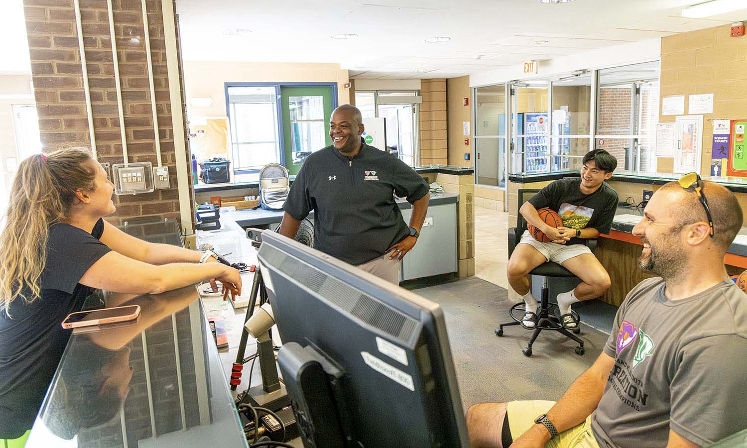 In the Bristol Field House, Assistant Director of Athletics for Sports Performance Brittany Krivicich, Director of Recreation, Intramurals and Fitness Jacob Lees, Andy Dinh ’27 and Assistant Director of Recreation, Intramurals and Fitness Deven Siesel discuss the programming for the upcoming semester. 
