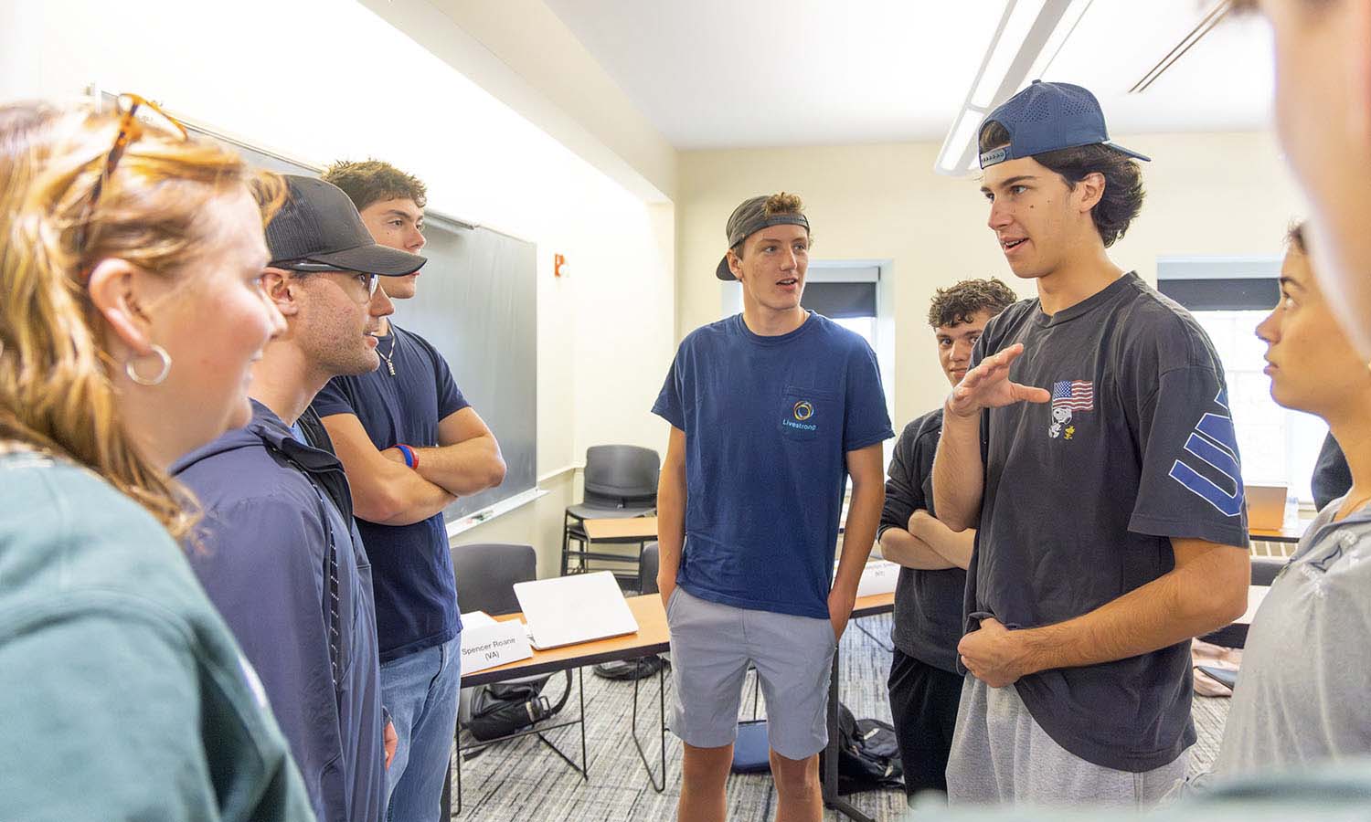 Students in “American Conflict” with Associate Professor of History Laura Free participate in a debate about the Constitution. 