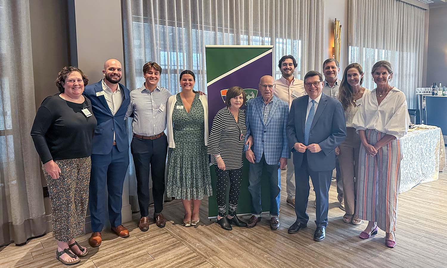Professor of Environmental Studies Kristen Brubaker, Dean of Admissions and Financial Aid Steven Simons, Jesse Whelan-Smalls ’24, Senior Assistant Director of Admissions Hannah Rolfe ’21, Dorothy and Henry Rosenberg Jr. ’52, L.H.D. ’02, President Mark D. Gearan, Jack Finnerty ’24, Tom Finnerty P’24, P’27, Wesley Finnerty P’24, P’27 and Vice Chair of the Board of Trustees Sana Naylor Brooks ’89 gather for an event for high school counselors in Baltimore, Md.   