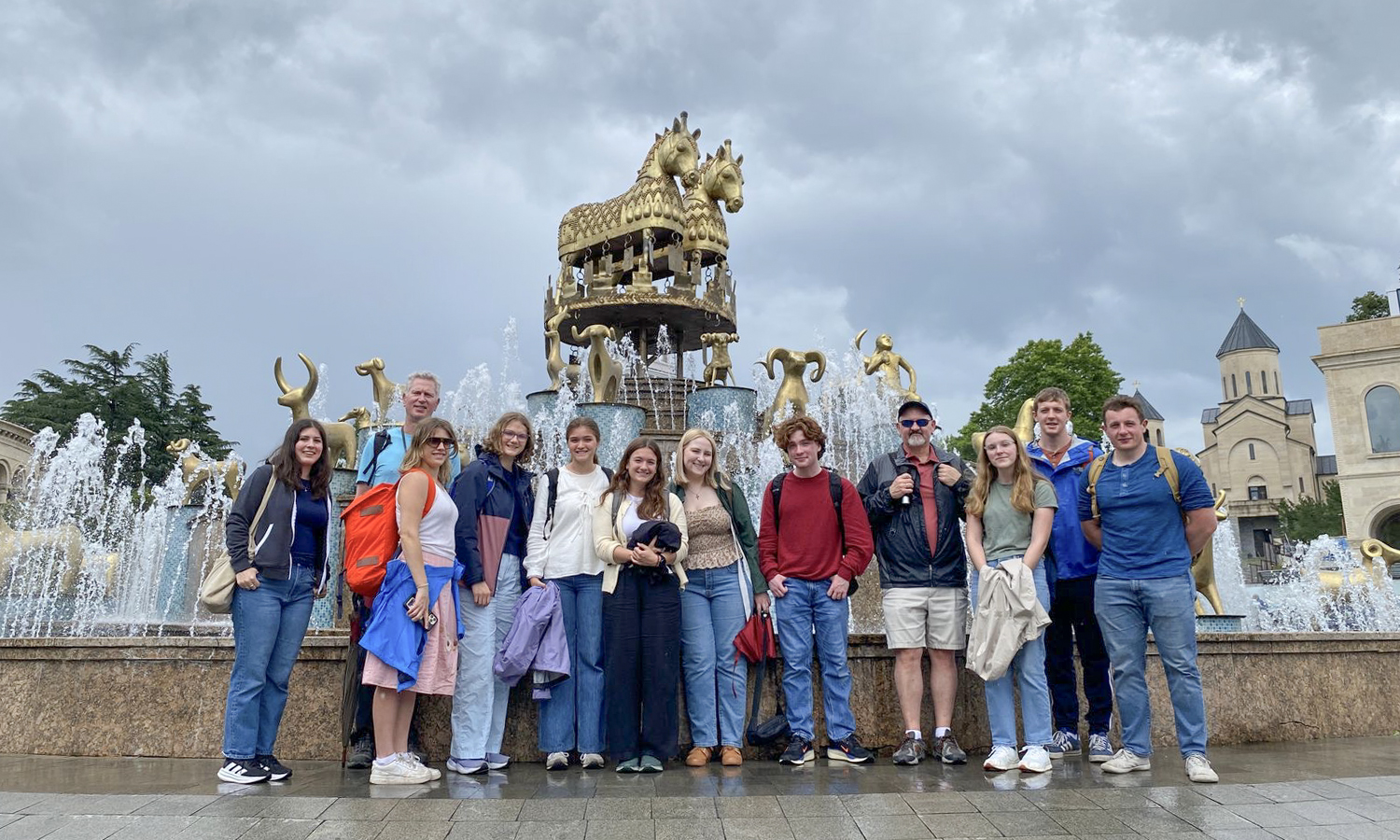 Students taking part in a seven-week program in the Republic of Georgia with Associate Professor of Russian Area Studies David Galloway and Associate Professor of Economics Keoka Grayson gather for a picture in front of the Colchis Fountain in the city of Kutaisi. 