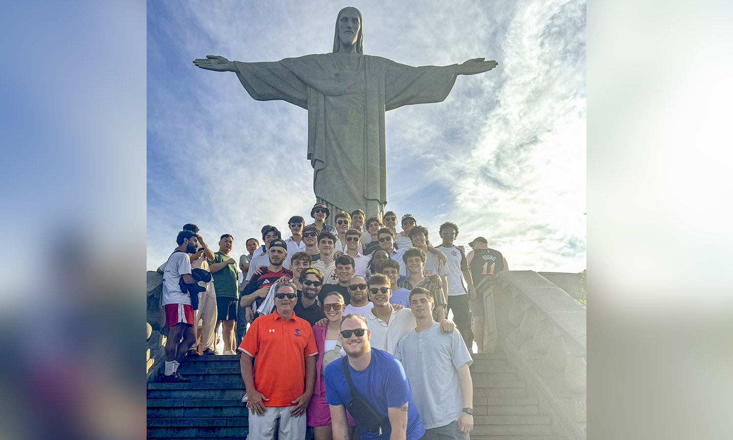 The Hobart soccer team poses for a photo in front of one of the seven wonders of the world, the Christ the Redeemer Statue in Rio de Janeiro, Brazil.  