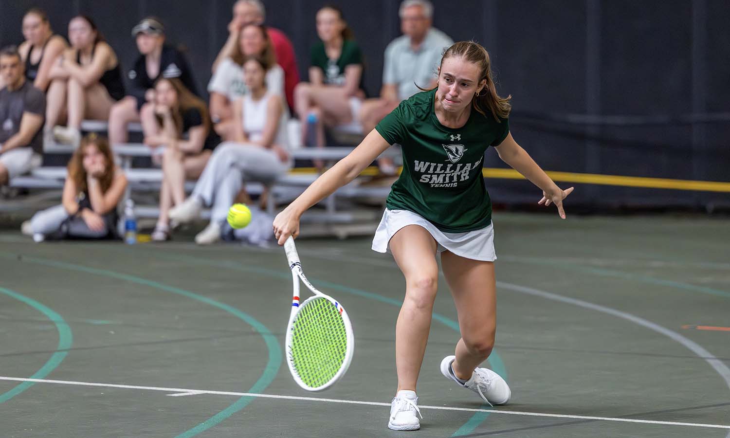 Katie Hardy ’29 returns a backhand shot during William Smith tennis’ victory over Nazareth. 