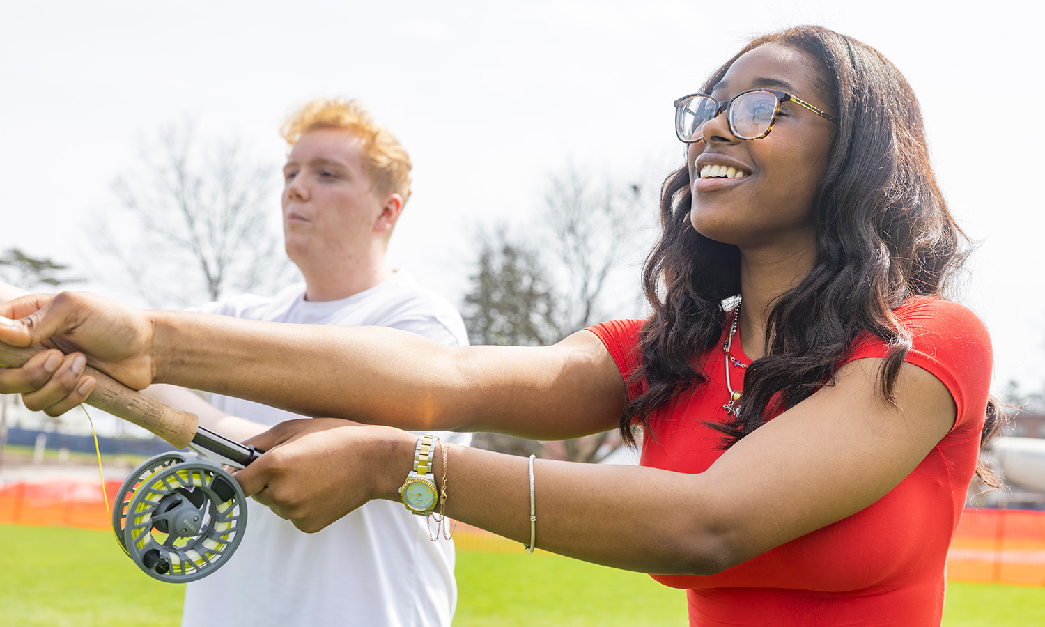 Payton Owens ‘28 teaches Brianna Desir ‘28 how to cast with a fly rod during a Fly Fishing Club meeting. 