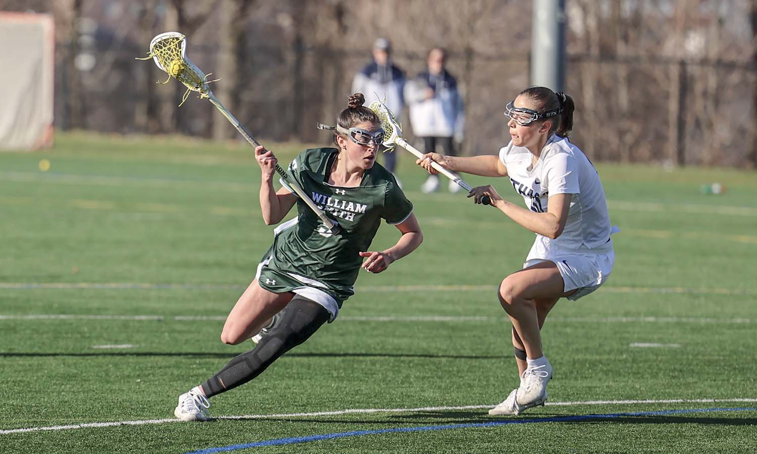 Delaney Cassidy ’26 runs past a defender on her way to goal. Cassidy and the Heron lacrosse team beat Ithaca 18-5 on Wednesday in Ithaca. 