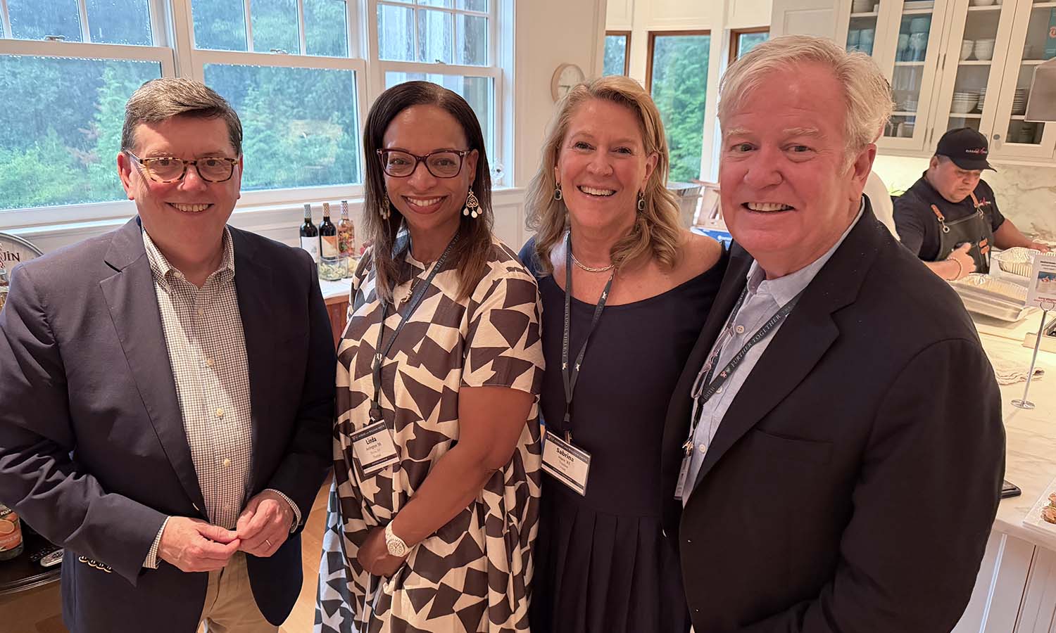 President Mark D. Gearan joins Trustee Linda Arrington ’88, Trustee Sabrina Horn ’83 and Patrick McCooey ’82 at the HWS Summer Gathering in the Hamptons, hosted by Horn at her home. 